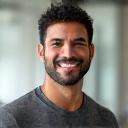 Mark Rodriguez, a fit male wellness coach smiling